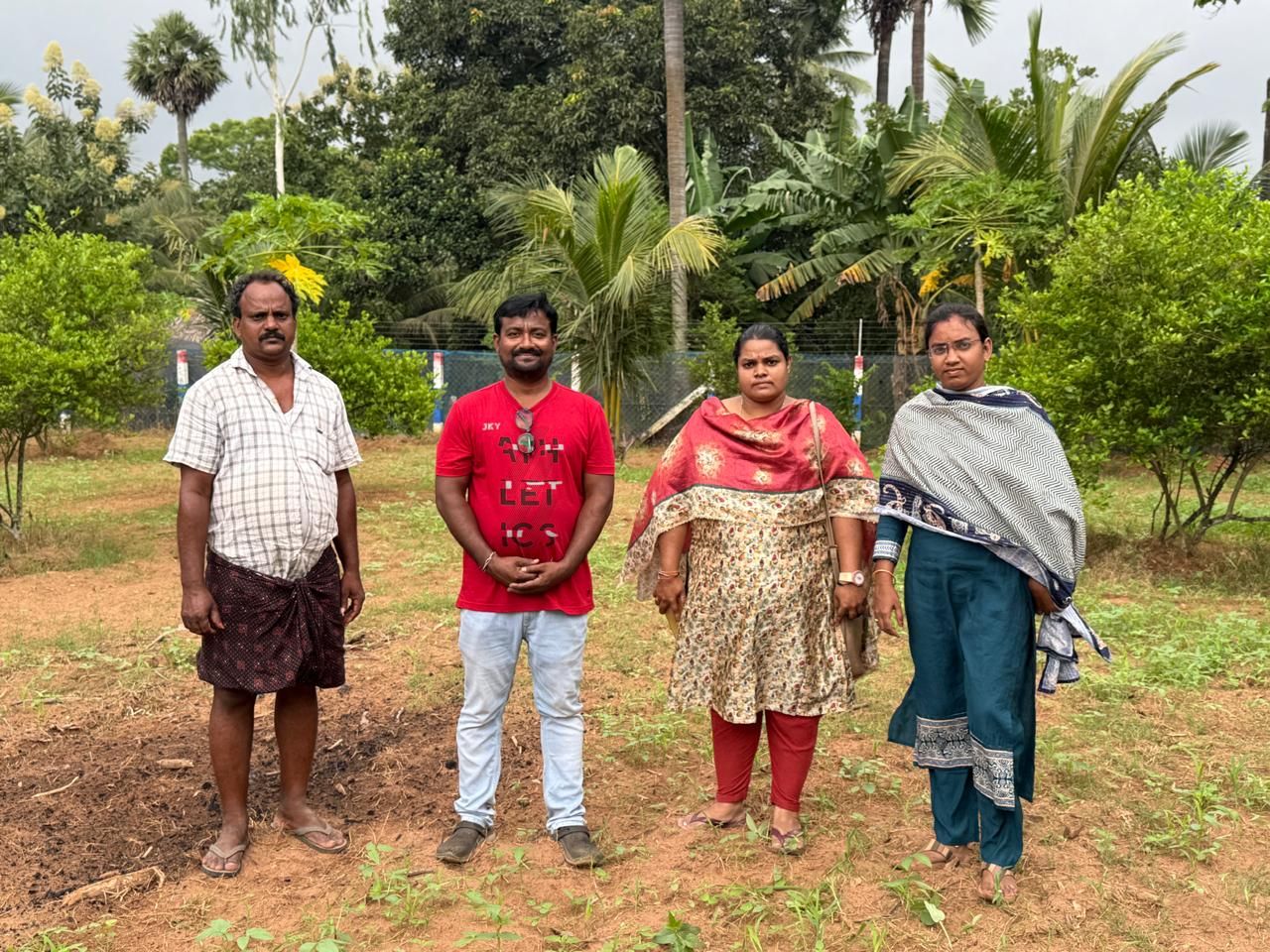 Foundation members with farmers on the farm